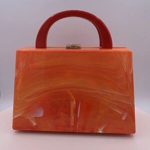 NWOT, hard shell acrylic handbag/purse/cross body.  Holds phone, summer colour